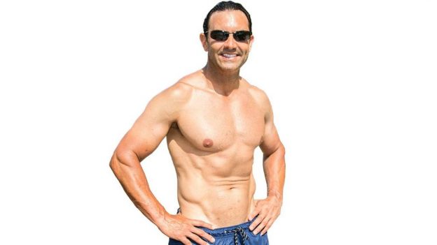 Shirtless man show8ing results from the Cenegenics program