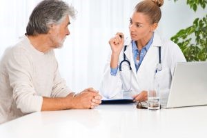 Female Dr. consulting with man at a low-t center