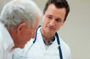 physician meeting with patient to discuss low testosterone, physician discussing hormone replacement therapy with testosterone deficient patient