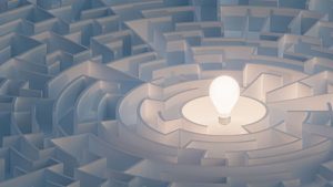A light bulb in the middle of a white maze, an example of neurocognitive testing