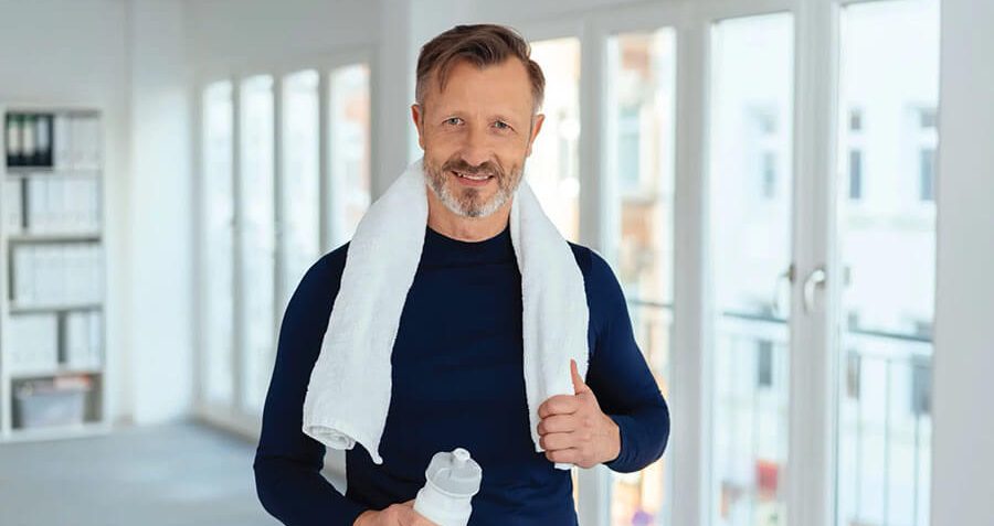 Mature fit man done with exercising which helps reduce the risk factors of shortened telomeres