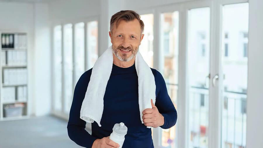 Mature fit man done with exercising which helps reduce the risk factors of shortened telomeres