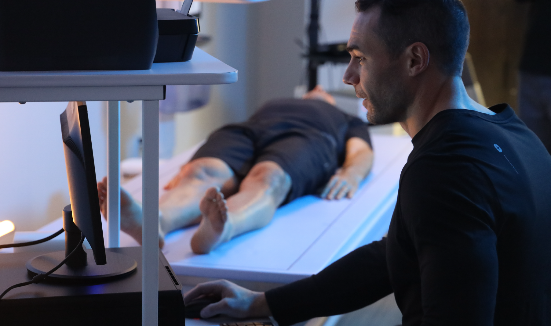 Performance Health Coach conducting a Performance Health Assessment on a Cenegenics Member